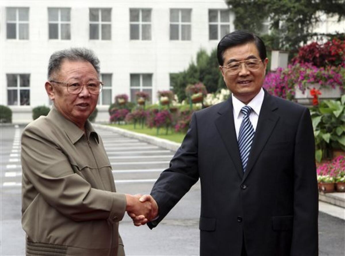 FILE - In this Aug. 27, 2010 file photo released by China's official Xinhua news agency, Chinese President Hu Jintao, right, meets with North Korean leader Kim Jong Il in Changchun, in northeast China's Jilin province. North Korea will hold its biggest political meeting in 30 years next week, state media reported Tuesday, Sept. 21, 2010, as observers watched for signs that the secretive regime's aging leader has chosen his son to succeed him. (AP Photo/Xinhua, Ju Peng, File) NO SALES