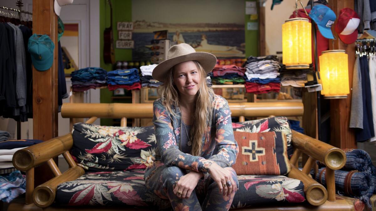Paige Mycoskie sits inside the Aviator Nation flagship store on Abbot Kinney Boulevard in Venice. (Jenna Schoenefeld / For The Times)