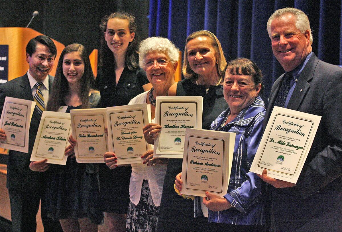 Les Tupper Community Service Award recipients Joel Peterson Andrea Klein, Talia Bernhard, Rosemary Hook for the Friends of the La Canada Flintridge Library, Heather Haaga, Patricia Anderson, and Michael Leininger, smile witht their award, presented by the La Canada Flintridge Coordinating Council at JPL La Canada Flintrdige on Monday, May 13, 2013. The 45th annual award was given to seven recipients.