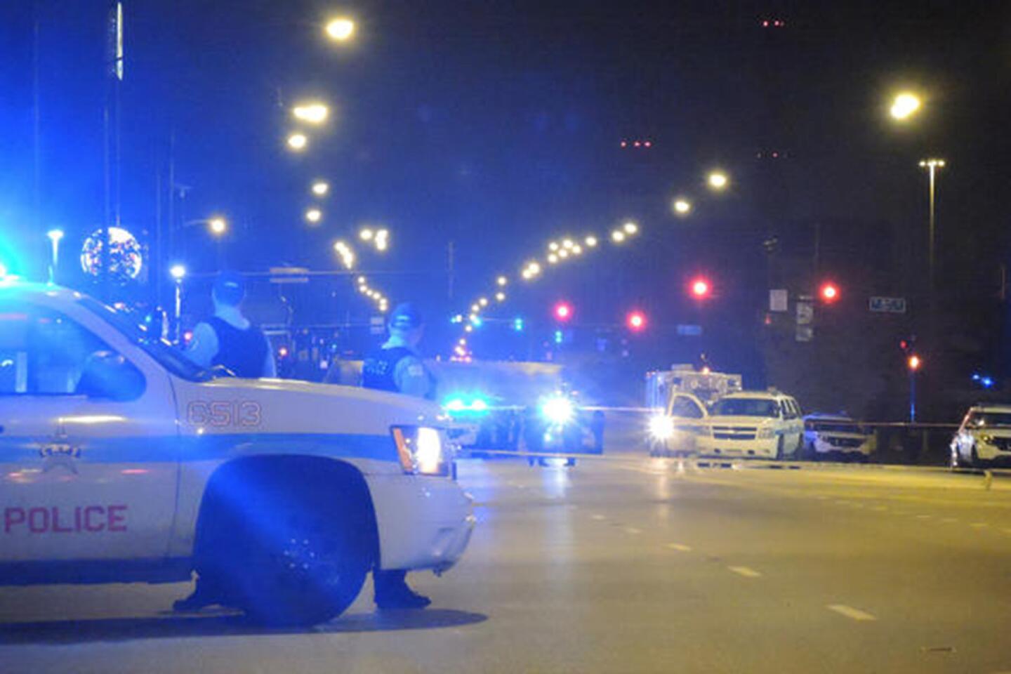 Police redirect traffic near the 4100 block of South Pulaski Road where Laquan McDonald was fatally shot by Chicago police in October 2014.
