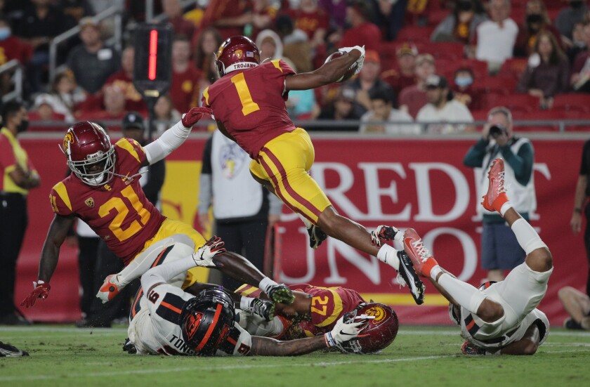 USC Trojans wide receiver Gary Bryant Jr. leaps over his teammate running back Quincy Jountti.