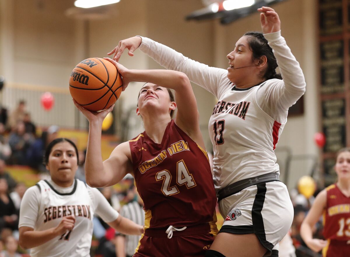 Ocean View's Lily Campbell (24) goes up and under the defense of Segerstrom's Abril Penaloza (13) on Wednesday.