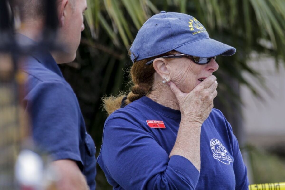 Jane Parnes, a volunteer with Seal Beach Animal Care Center, is distraught at the scene of a house fire where a man and his dog were killed. Parnes knew the victim.