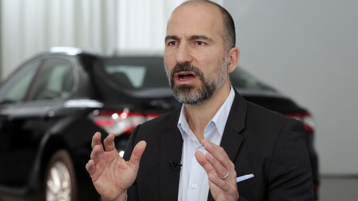 Uber CEO Dara Khosrowshahi gestures as he answers a question during a 2018 interview in New York.