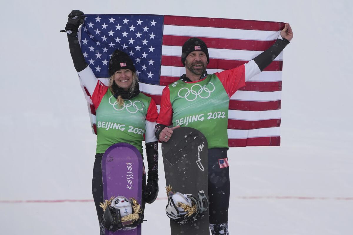 Lindsey Jacobellis and Nick Baumgartner of the United States celebrate their gold-medal win.