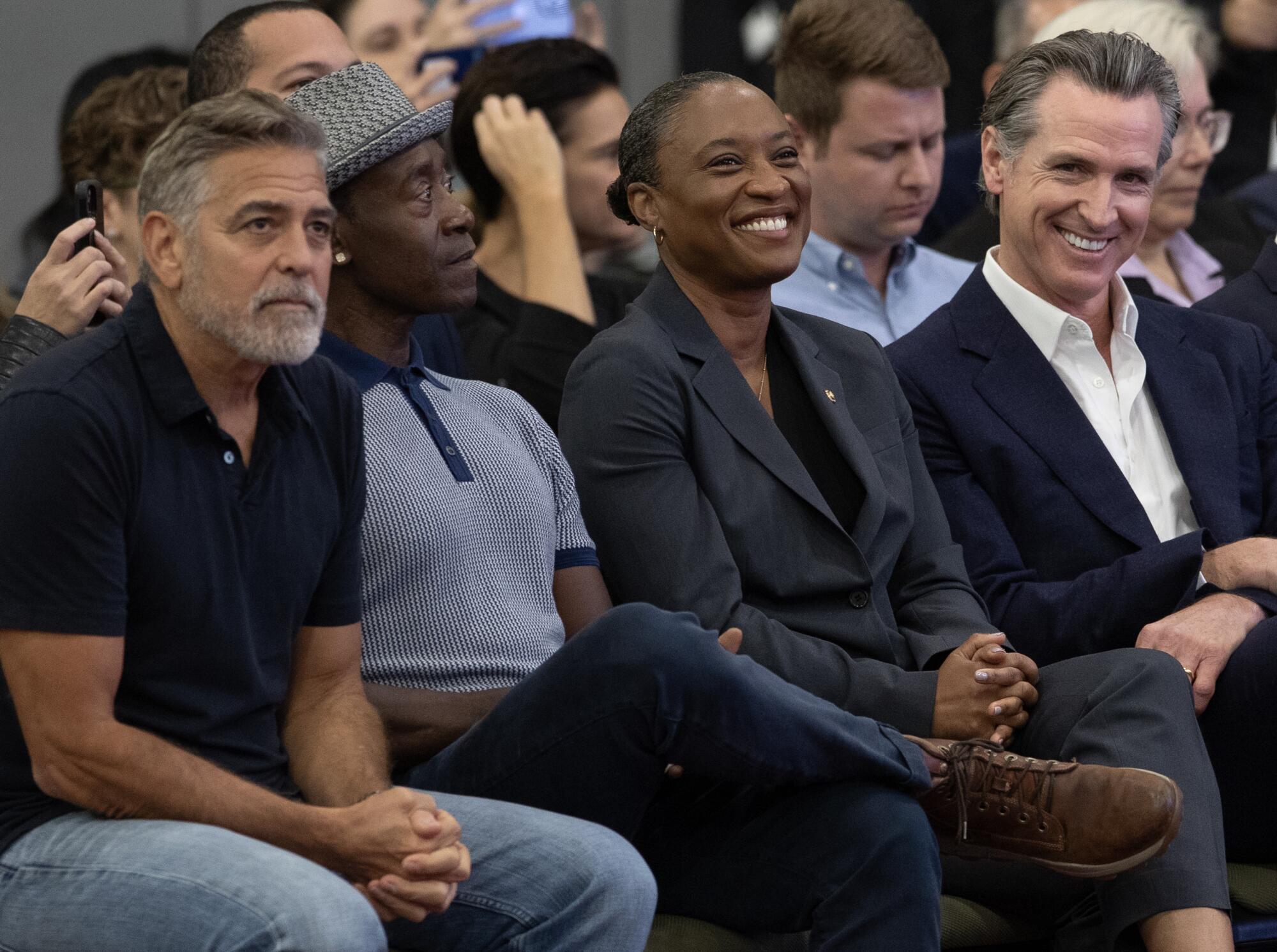 Left to right-Actor George Clooney, actor Don Cheadle, U.S. Senator Laphonza Butler, and California Governor Gavin Newsom,