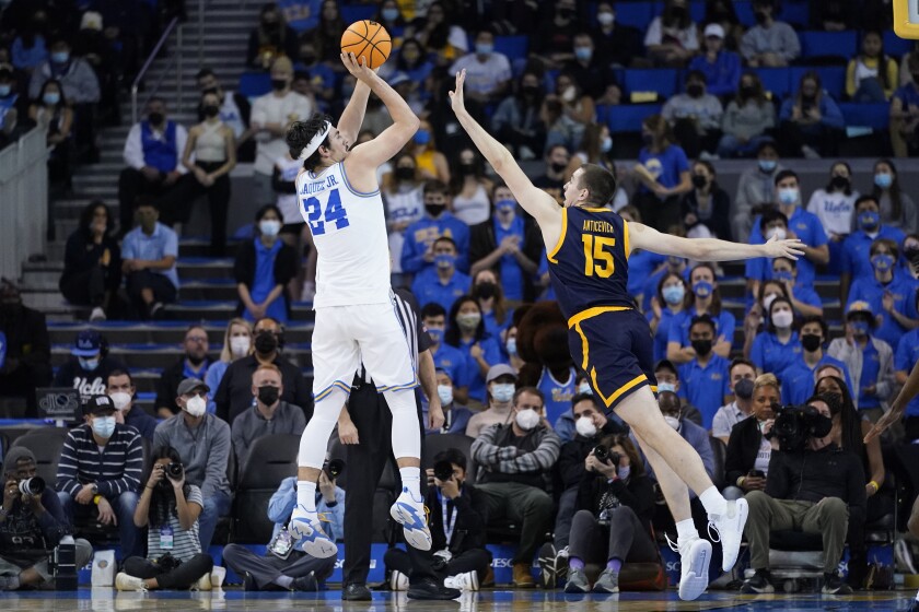 UCLA guard Jaime Jaquez Jr. (24) shoots against California forward Grant Anticevich (15) during the first half of an NCAA college basketball game in Los Angeles, Thursday, Jan. 27, 2022. (AP Photo/Ashley Landis)