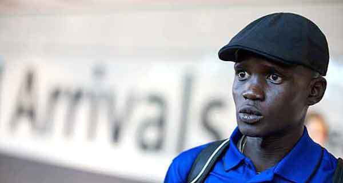 Guor Marial speaks to reporters as he arrives at Heathrow Airport in London last week.