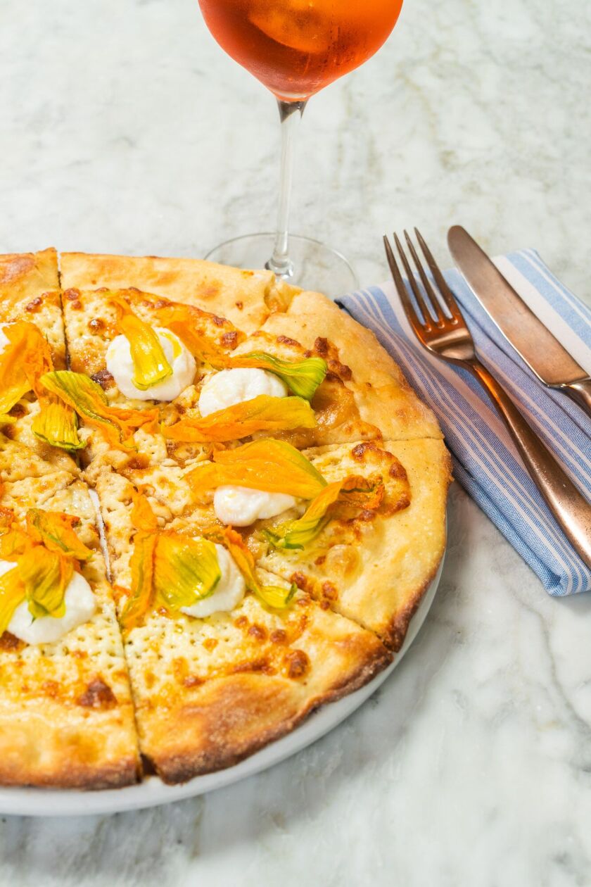 Provisional Kitchen, at downtown San Diego’s Pendry hotel, makes a mean pizza, including this delicate squash blossom pie.