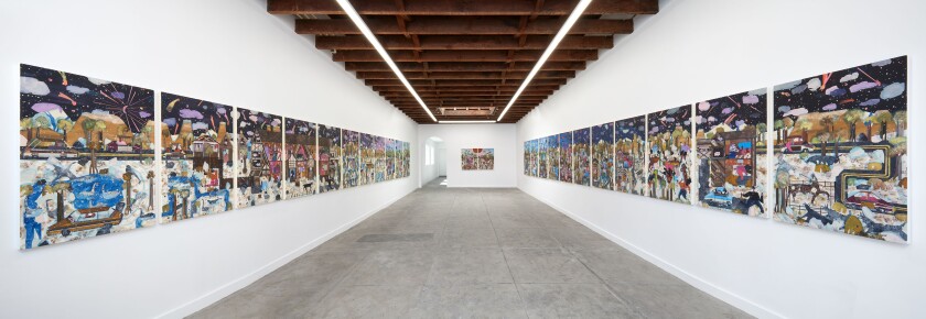 Colorful works of art line gallery walls.