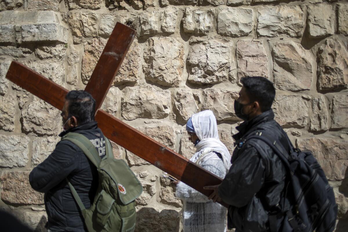 Christians carry a cross in Jerusalem.