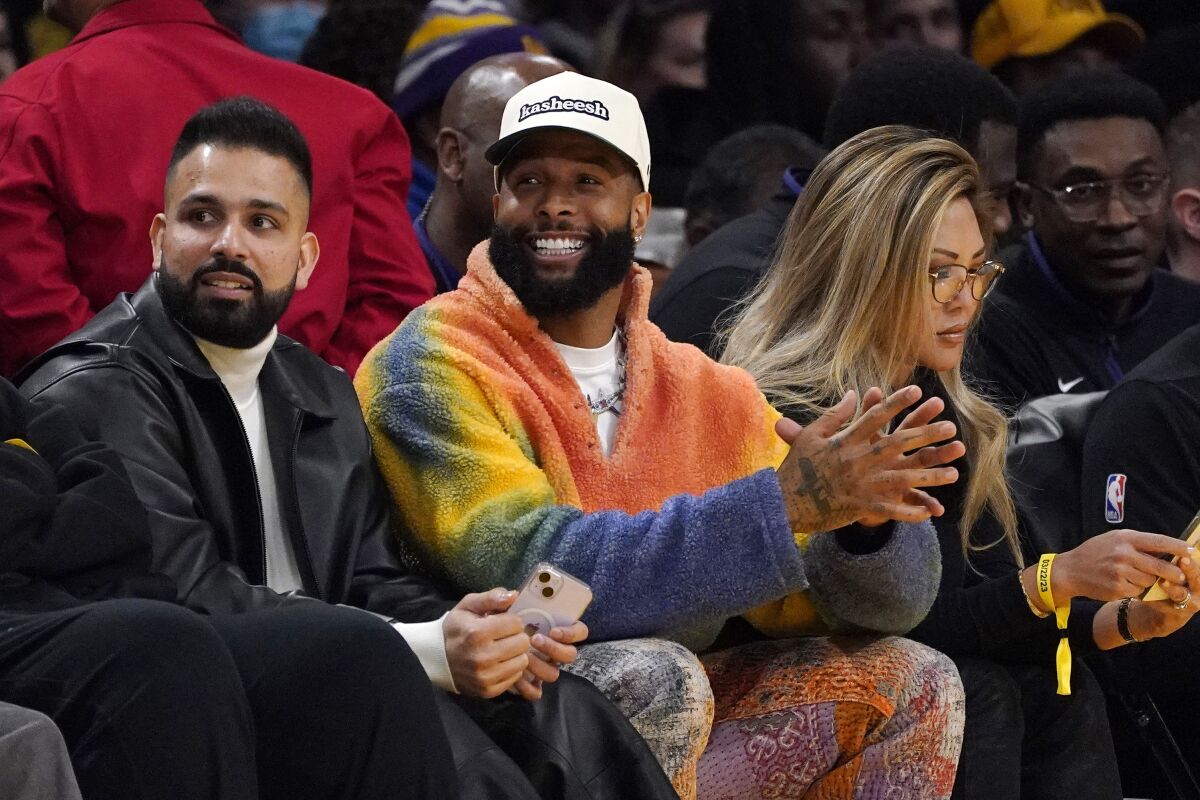 Odell Beckham Jr., center, watches the Lakers-Suns game on March 22 in Los Angeles. 