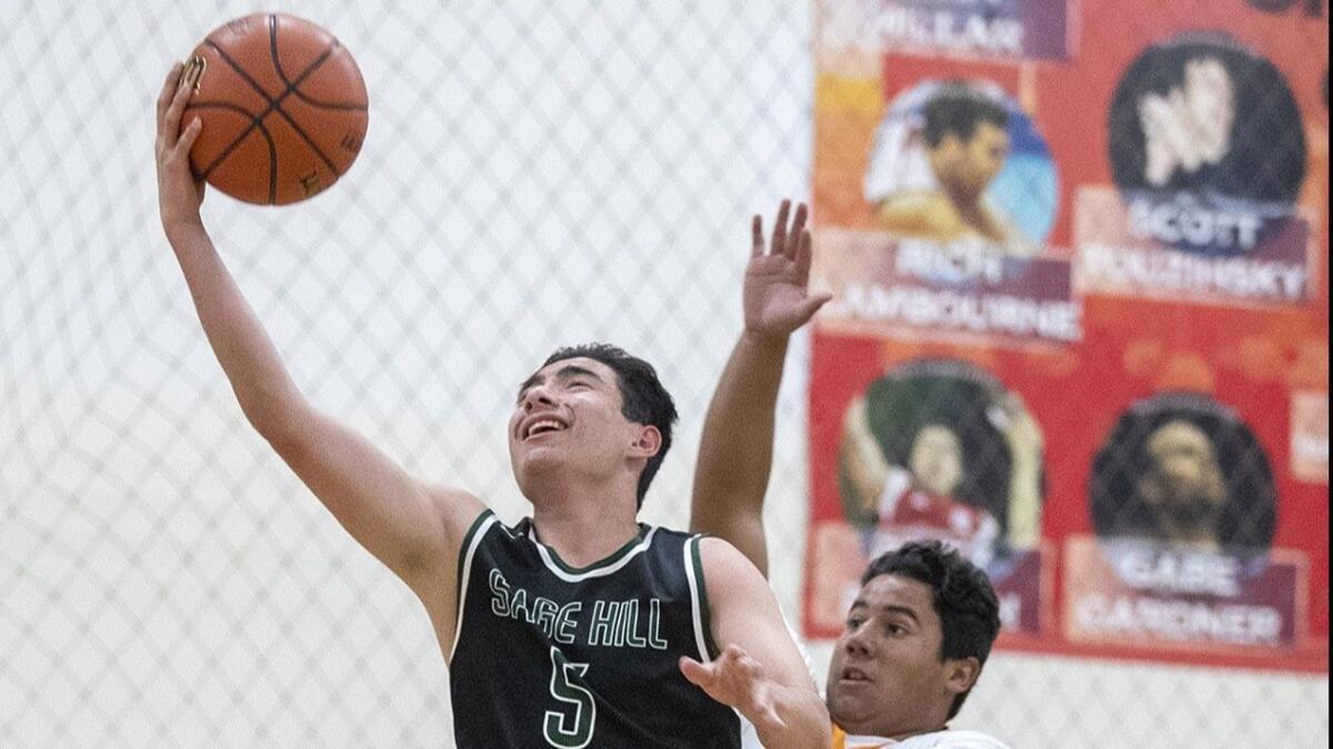 Sage Hill School's Mitchell Frye takes a shot under pressure from Samueli Academy's Sean Rodriguez in a nonleague game at the American Sports Centers complex in Anaheim on Wednesday.