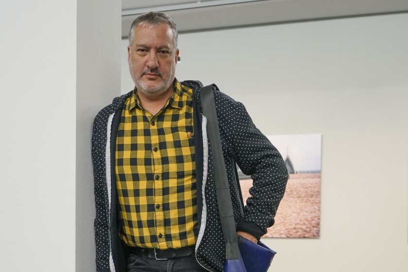 This photo taken Oct. 3, 2019 shows artist Spencer Tunick, a photographer known internationally for his shoots assembling masses of nude people, at the FLATZ Museum in Dornbirn, Austria. The unclothed human body accounts for the bulk of the material Facebook removes from its service and activists, sex therapists, artists and sex educators say the company is unfairly censoring their work, suspending them in "Facebook jail" with no warning and little, if any recourse. (Roland Joerg/FLATZ Museum via AP)