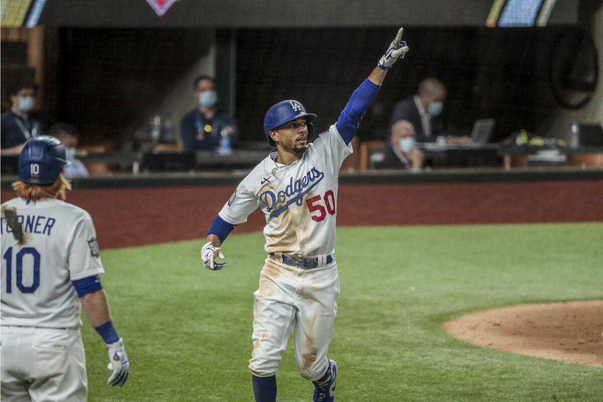 Dodgers right fielder Mookie Betts celebrates after hitting a home run.