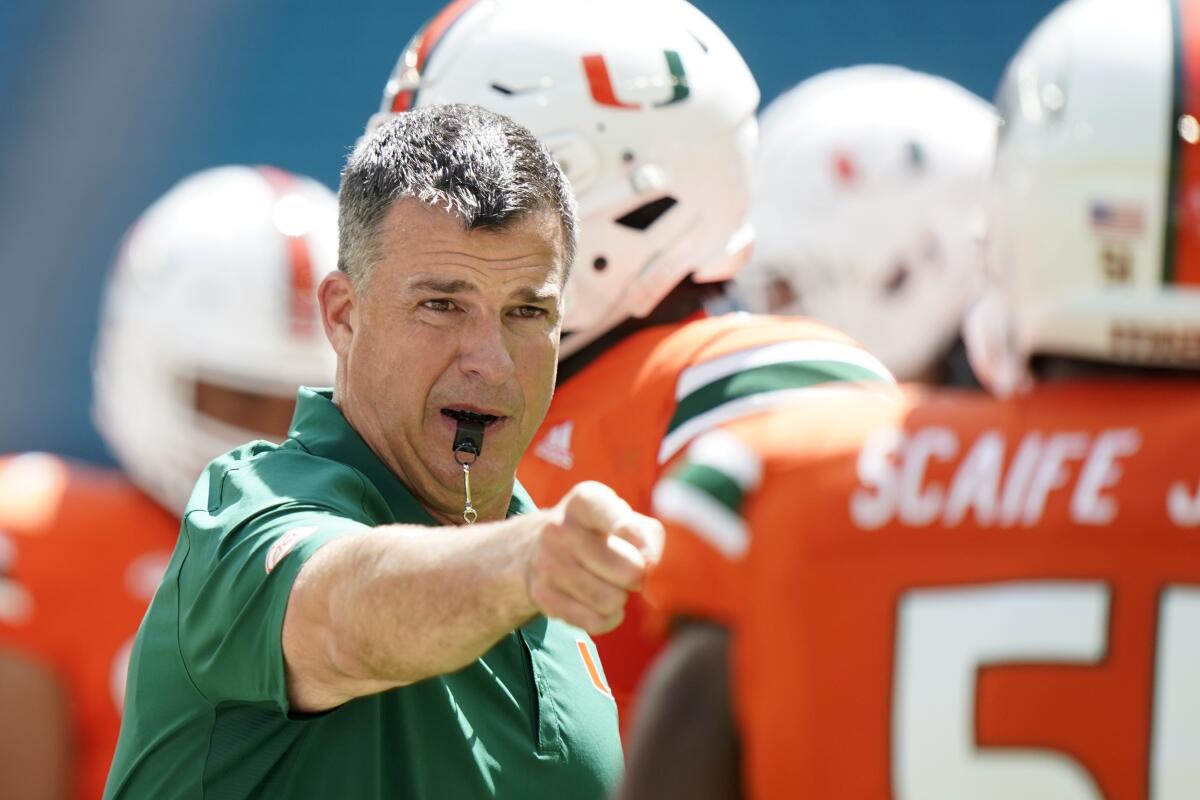 Miami coach Mario Cristobal directs his players before a game against Southern Miss on Sept. 10.