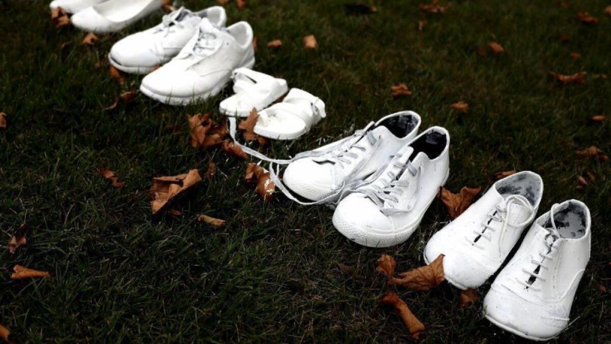 Shoes in front of a church honor Muslim victims of an attack in New Zealand.