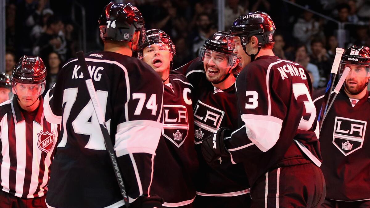 Kings players (from left to right) Dwight King, Dustin Brown, Drew Doughty, Brayden McNabb and Jarret Stoll celebrate Brown's second-period goal during a 6-1 win over the Edmonton Oilers on Tuesday.