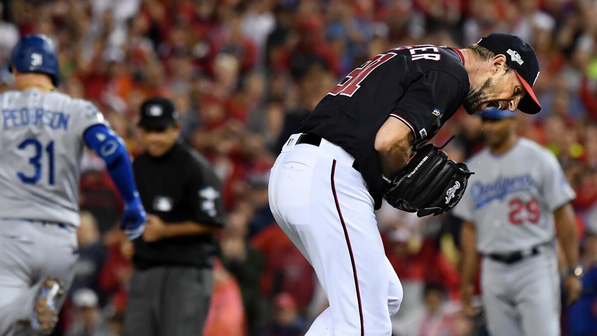 Ryan Zimmerman and Max Scherzer wore full Caps gear while leading