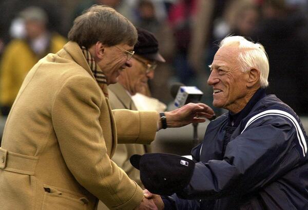 MLB commissioner Bud Selig welcomes former Detroit Tigers coach Sparky Anderson during a ceremony to open the Detroit Tigers' new home, Comerica Park. Anderson would also enter the Baseball Hall of Fame in 2000.