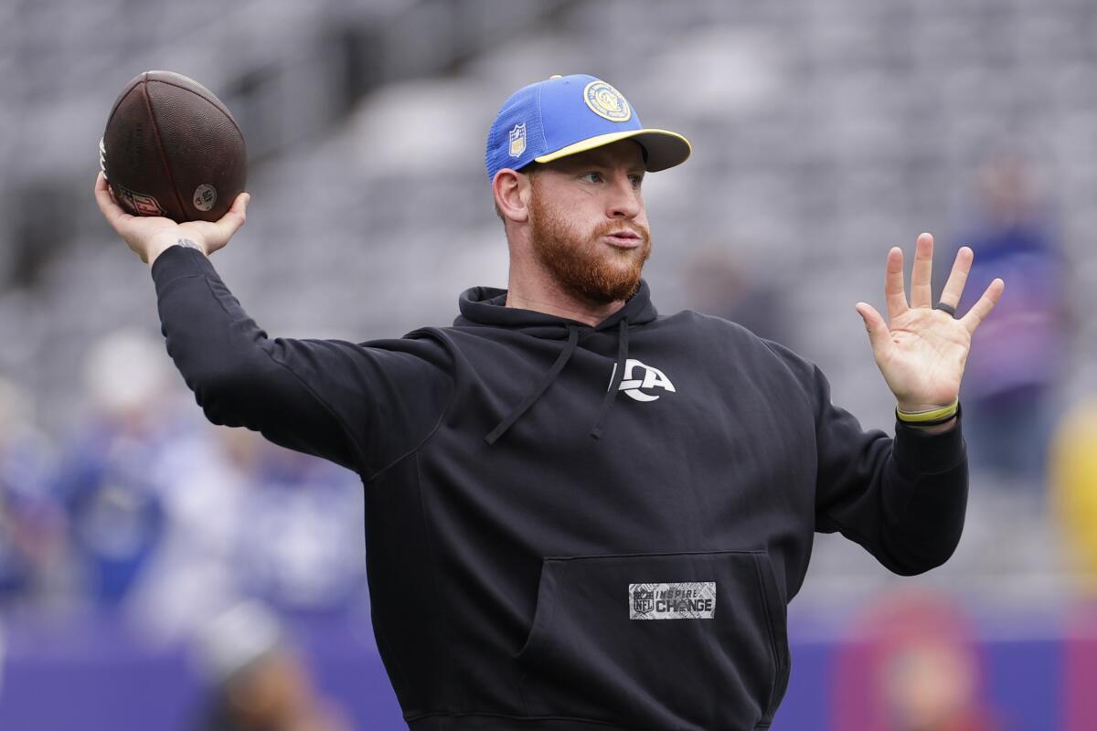 Rams quarterback Carson Wentz warms up before a win over the New York Giants on Dec. 31.