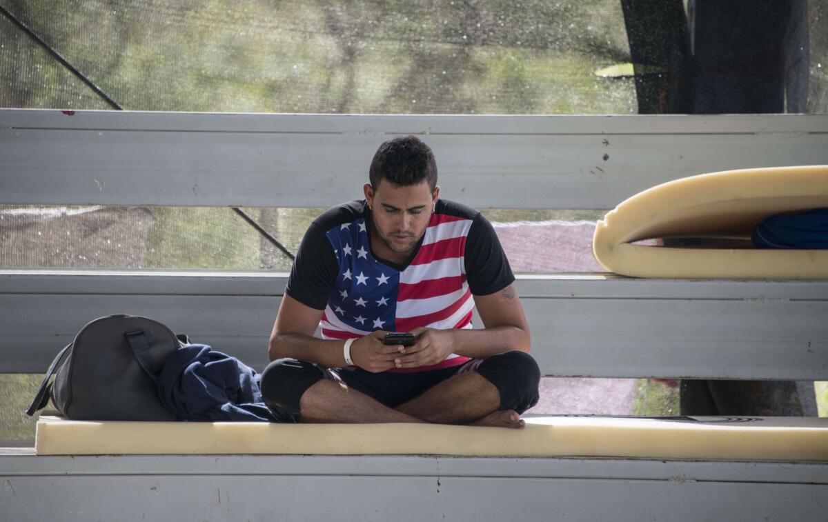 A man rests at a shelter where a group of 300 Cubans remain, in La Cruz, Costa Rica, near the border with Nicaragua on Thursday. Many Cuban migrants heading to the U.S. begin their journey by flying to Ecuador.