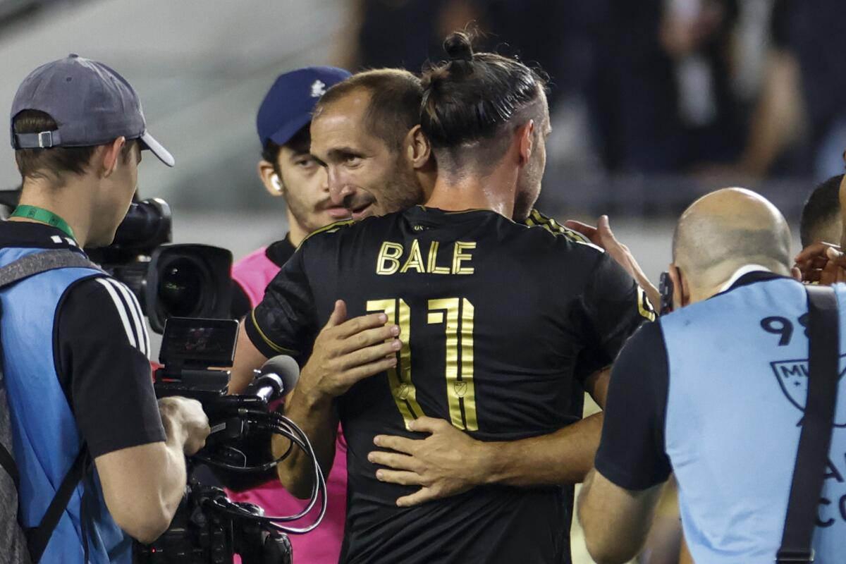 LAFC's Giorgio Chiellini celebrates with Gareth Bale after the team's win over the Seattle Sounders on Friday.
