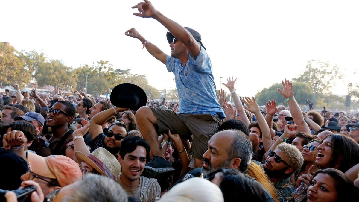 A fan crowd surfs at the 2017 edition of FYF Fest.