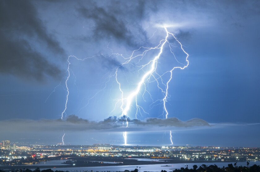 Lighting strikes the ground near Coronado as seen from Mt. Soledad during a lighting storm.