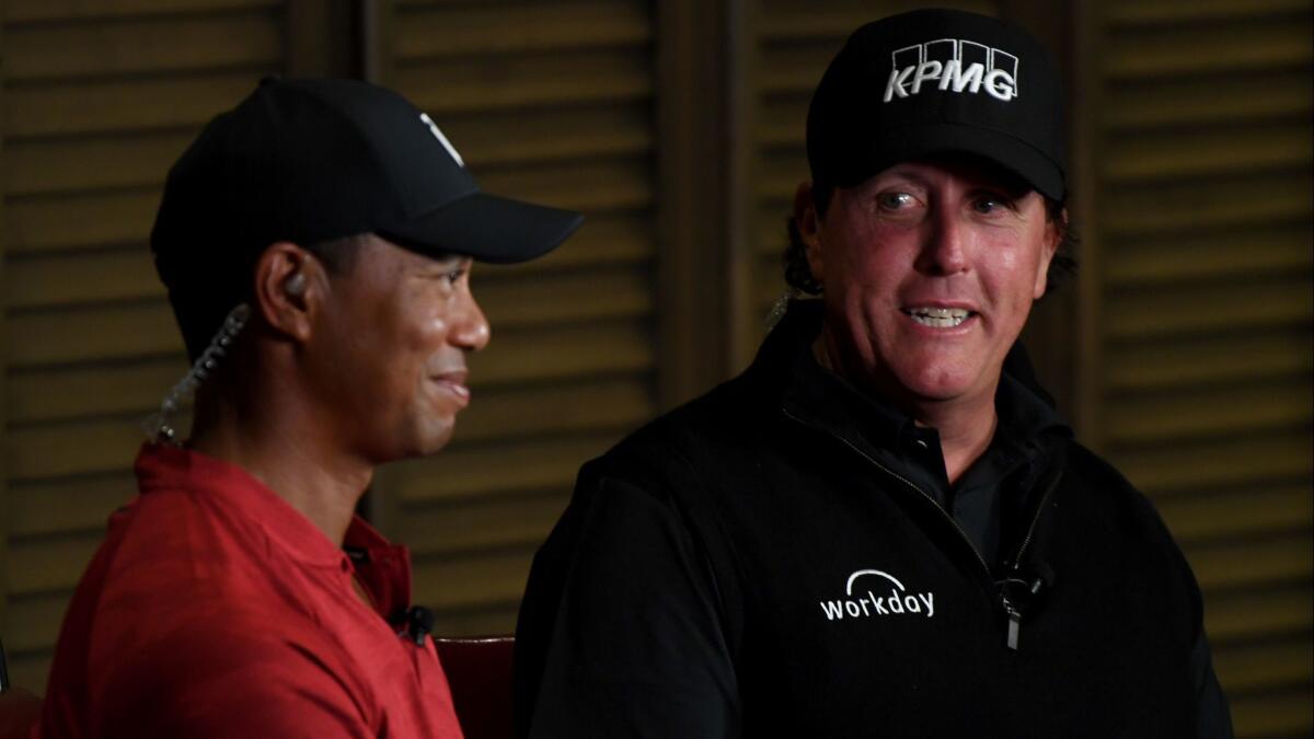 Phil Mickelson, right, and Tiger Woods record a promotional spot for their head-to-head match.