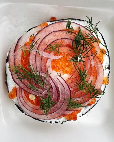 Salmon roe bagel with red onion, dill and cream cheese at Jyan Isaac Bread in Santa Monica.