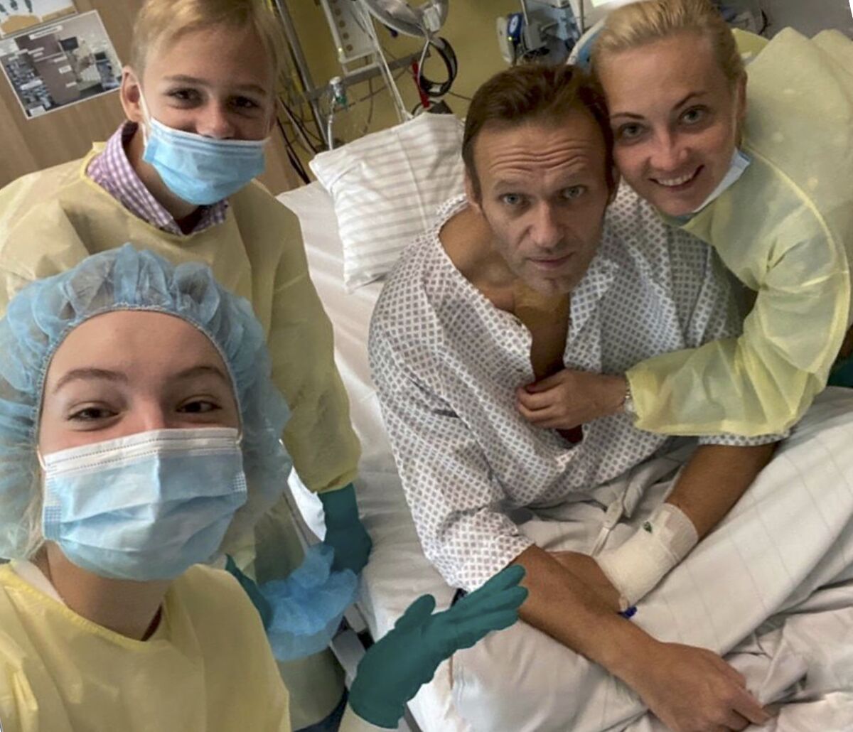 This handout photo published by Russian opposition leader Alexei Navalny on his instagram account, shows himself, centre, and his wife Yulia, right, posing for a photo with medical workers in a hospital hospital in Berlin, Germany. Russian opposition leader Alexei Navalny has posted the picture of himself in a hospital in Germany and says he's breathing on his own. He posted on Instagram Tuesday Sept. 15, 2020: "Hi, this is Navalny. I have been missing you. I still can't do much, but yesterday I managed to breathe on my own for the entire day." (Navalny instagram via AP)
