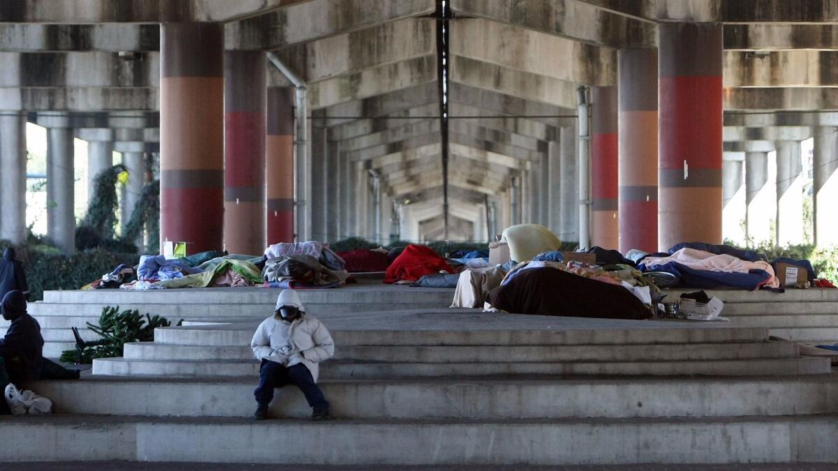Homeless people gather underneath an interstate highway in New Orleans. If the poorest Americans were clustered into a single state, the average life expectancy in that state would be lower than in half the world's countries, according to a new study.