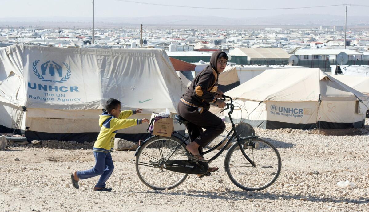 Young Syrians play in the Zaatari refugee camp in Jordan in 2015.