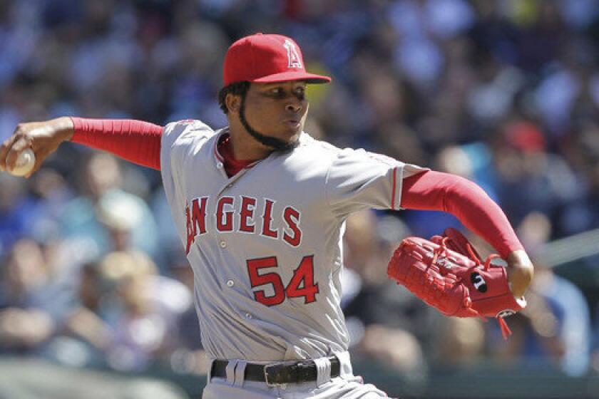 Angels right-hander Ervin Santana delivers a pitch during a game against the Mariners in September. The Angels traded the pitcher and cash to the Royals for triple-A hurler Brandon Sisk.