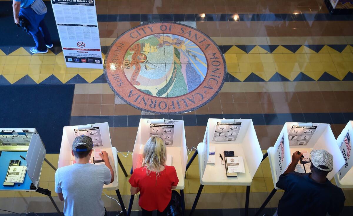 Voters cast their ballots in Santa Monica City Hall.