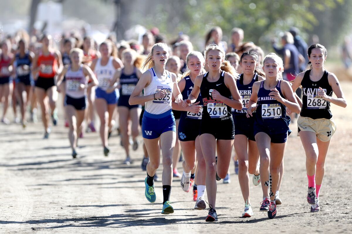 Village Christian junior Mia Barnett, center, won the 2019 Southern Section Division 5 girls' cross-country finals.
