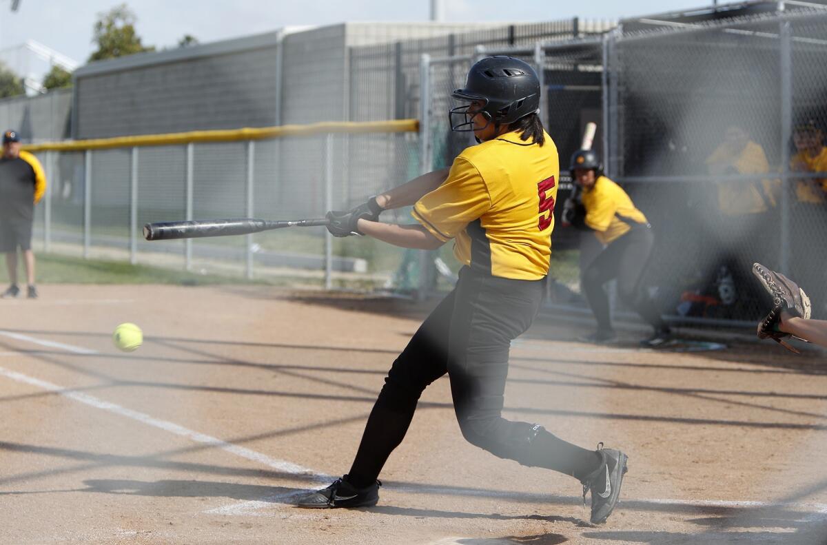 Estancia High's Micaiah Watanabe-Patterson hits a single during the second inning of an Orange Coast League game at Costa Mesa on Friday.