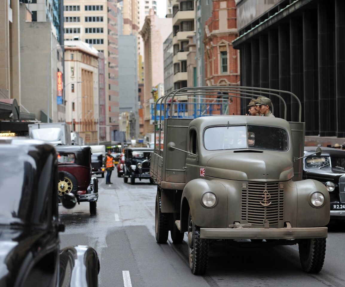 Crews set up to film using vintage 1930's-era cars in Sydney's central business district.