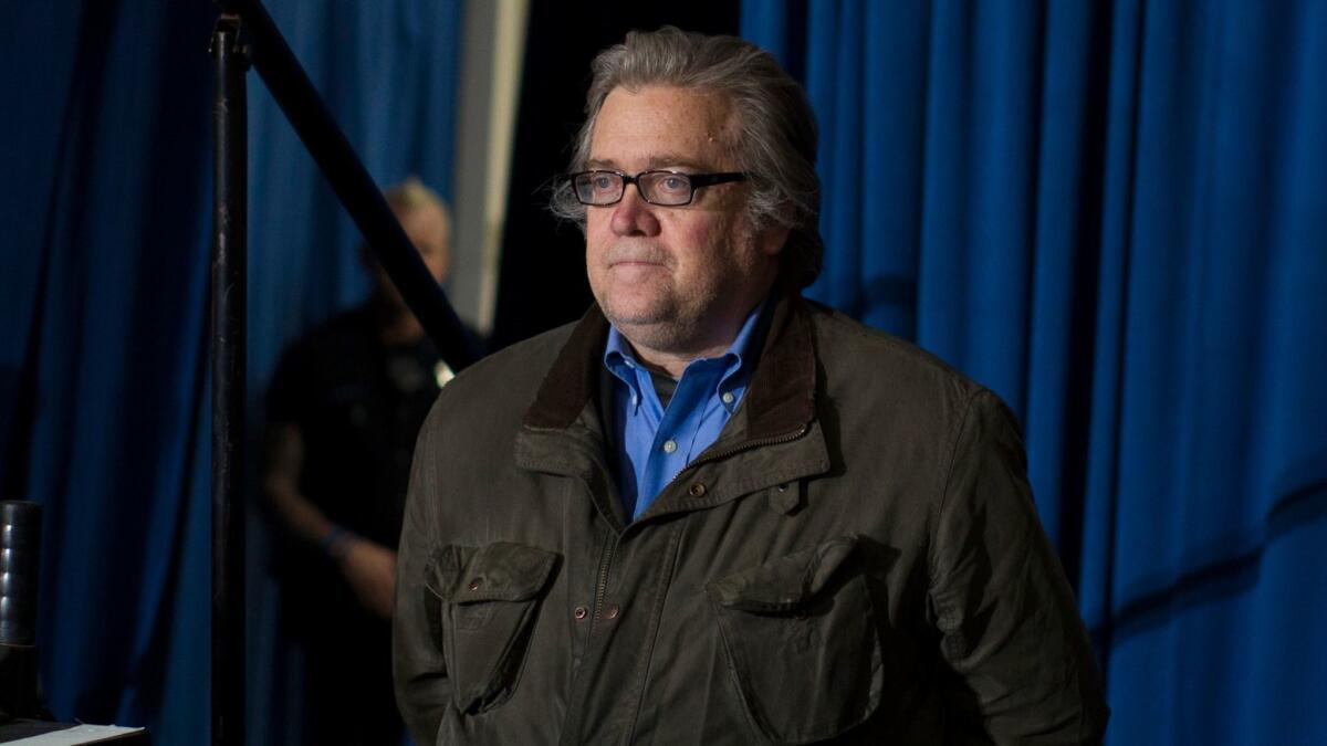 Stephen Bannon, campaign CEO for Republican presidential candidate Donald Trump, looks on as Trump speaks during a campaign rally in Denver on Nov. 5.