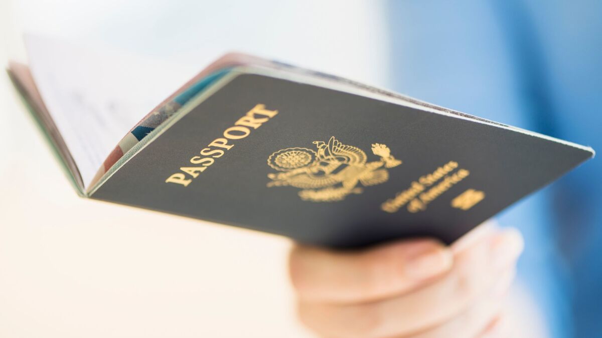A woman holds her U.S. passport.