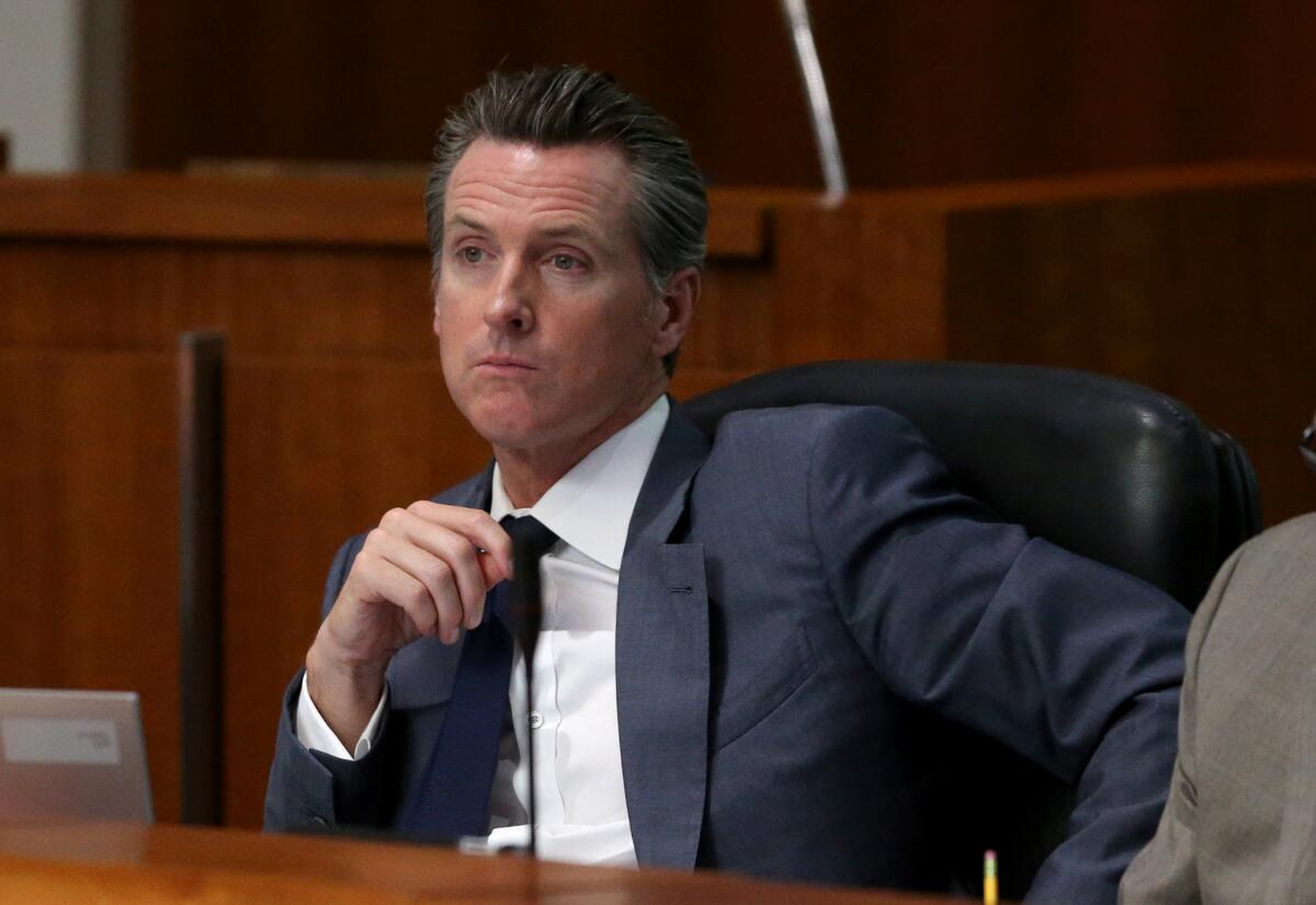 Gov. Gavin Newsom, seen here in a file photo, defended his position on controversial vaccine legislation in comments to reporters on Monday.