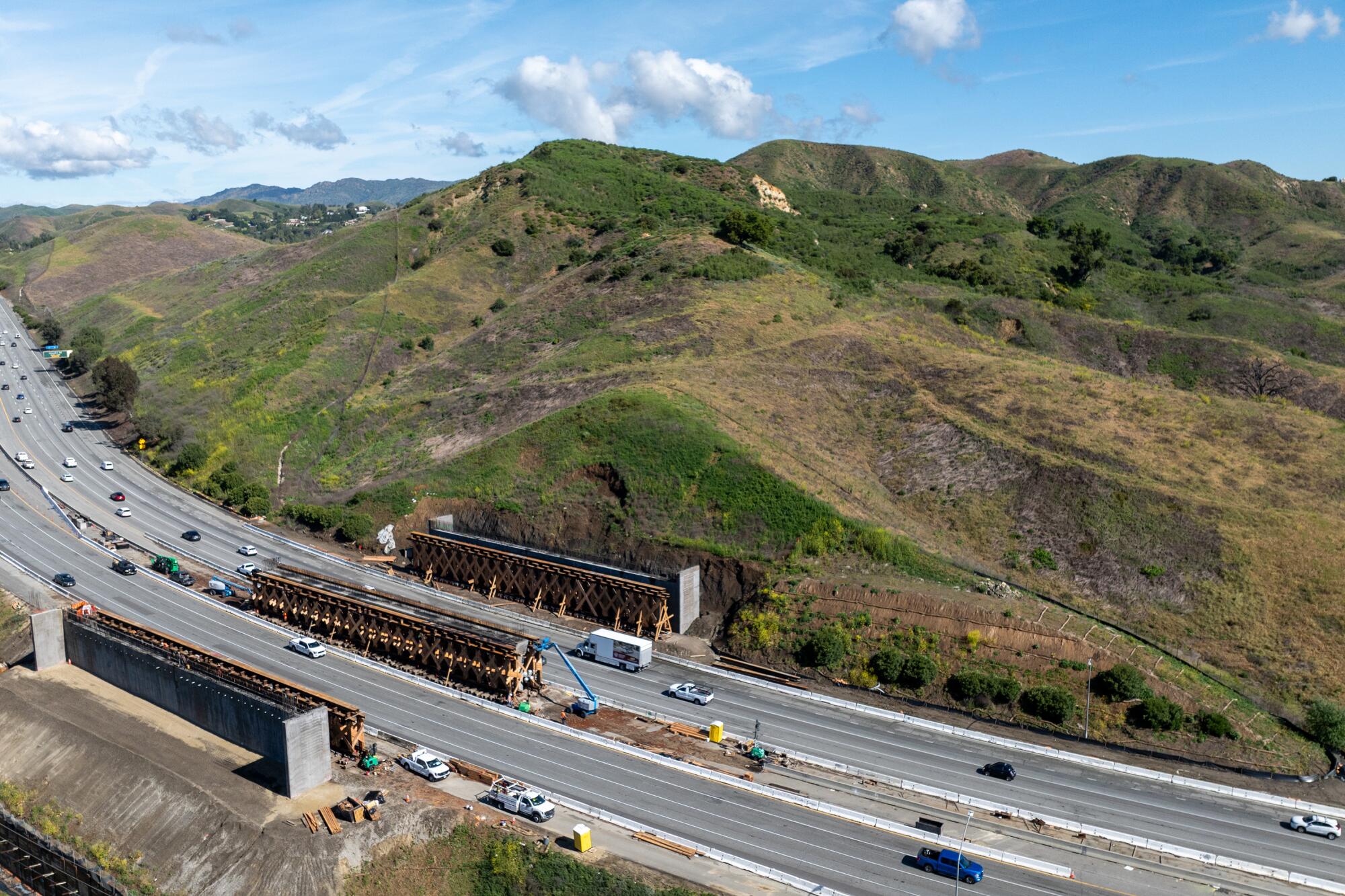 Aerial view of construction on the 101 Freeway in Agoura Hills and surrounding landscape.