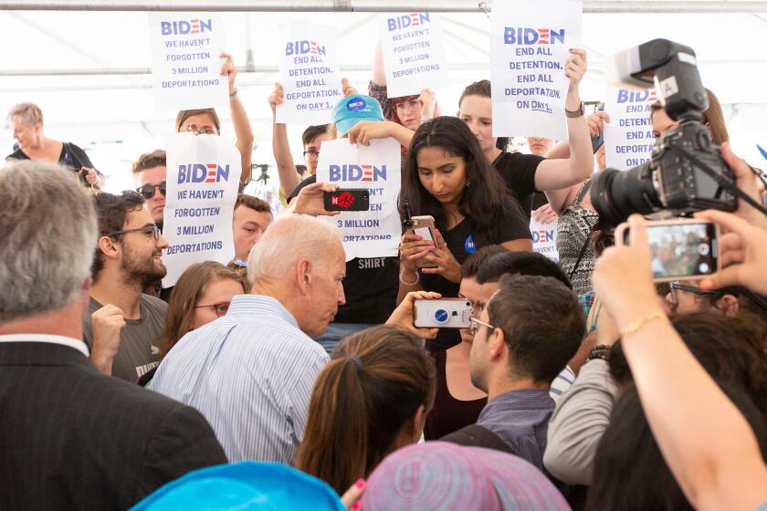 Mandatory Credit: Photo by CJ GUNTHER/EPA-EFE/REX (10333237j) Democratic candidate for United States President, Former Vice President Joe Biden, is surrounded by a group of protesters following a campaign stop in Dover, New Hampshire, USA 12 July 2019. Democratic candidate for United States President,Former Vice President Joe Biden campaigning in New Hampshire, Dover, USA - 12 Jul 2019 ** Usable by LA, CT and MoD ONLY **
