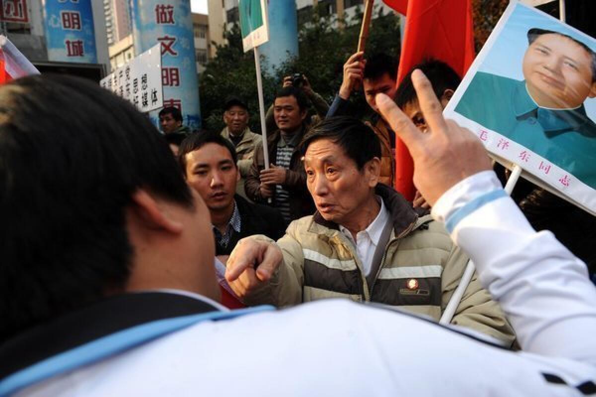 A demonstrator shouts slogans during a counter-demonstration against supporters of the Southern Weekly newspaper outside the newspaper's headquarters in Guangzhou in south China's Guangdong Province. A dispute over censorship at the Chinese newspaper owned by the Communist Party has led to protests.