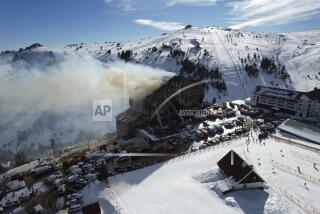 Firefighters work to extinguish a fire in a hotel at a ski resort of Kartalkaya, located in Bolu province, in northwest Turkey, Tuesday, Jan. 21, 2025. (Enes Ozkan/IHA via AP)