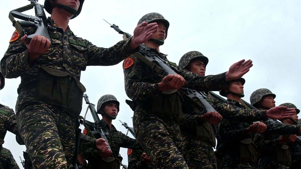 Members of Taiwan's 66th Marine Corps march in 2005 on the outskirts of Taipei, Taiwan. Other Taiwanese marines have been accused of taunting and killing a dog.