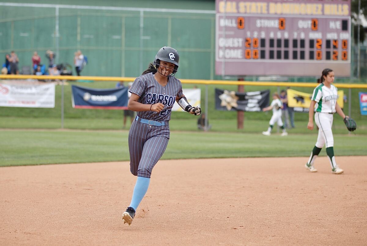 Carson High's Rylee Gardner rounds the bases after her solo home run in the third inning of the City title game.