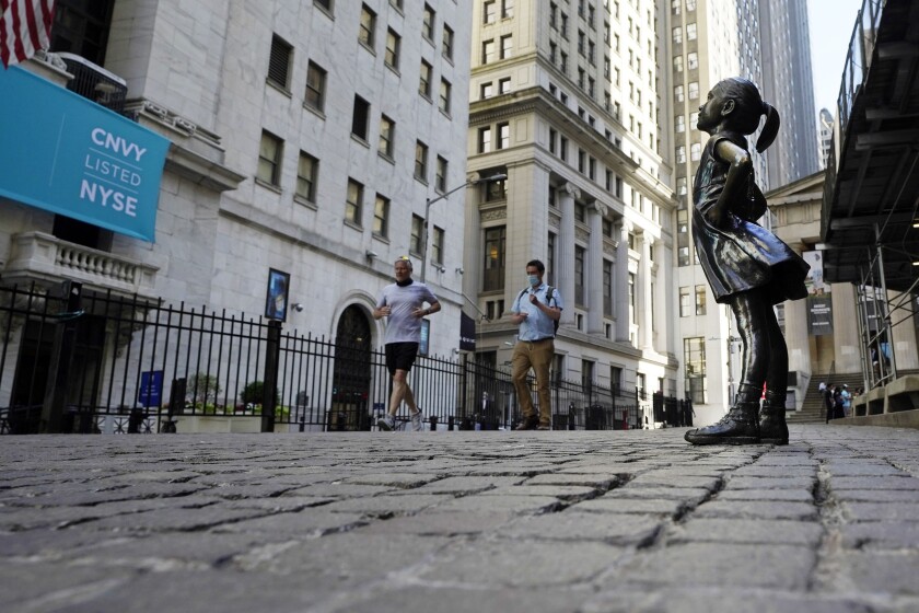 The "Fearless Girl" statue faces the New York Stock Exchange.