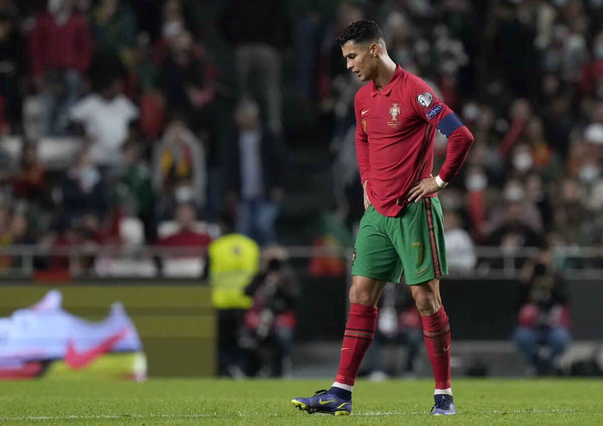 Portugal's Cristiano Ronaldo reacts after Serbia's Aleksandar Mitrovic scoring his side's second goal during the World Cup 2022 group A qualifying soccer match between Portugal and Serbia at the Luz stadium in Lisbon, Sunday, Nov 14, 2021. (AP Photo/Armando Franca)